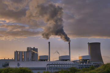 HDR Oil refinery, cooling towers, with smoke.