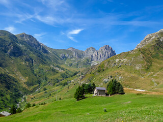 Panoramic mountain landscape of Cottian Alps in Grana Valley (Valle Grana) with clear blue sky on a...