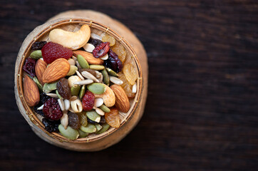 Grains such as almond seeds, pumpkin seeds on an old wooden  background.top view