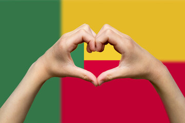 Benin flag with two hands heart shape, hand heart love sign, express love or affection concept