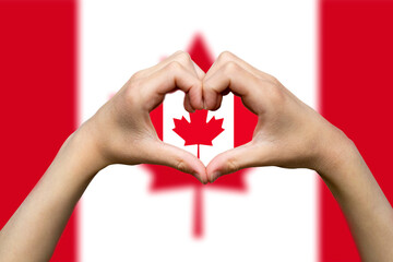 Canada flag with two hands heart shape, support or donate to Canada, express love or affection 