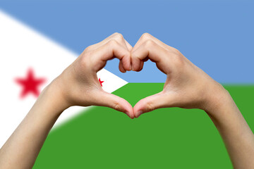 Djibouti flag with two hands heart shape, express love or affection concept, hand heart love sign