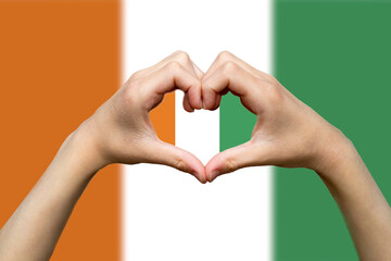 Ivory Coast flag with two hands heart shape, hand heart love sign, vector design, patriotism and 