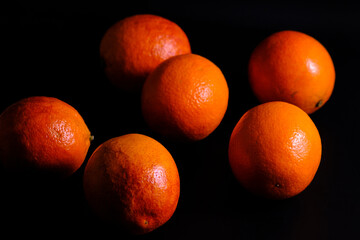 Fresh Juicy Blood Oranges on Dark Background