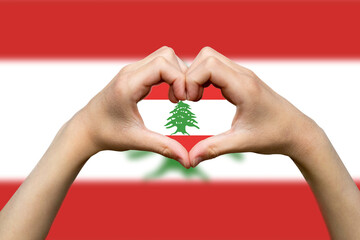 Lebanon flag with two hands heart shape, express love or affection concept, hand heart love sign