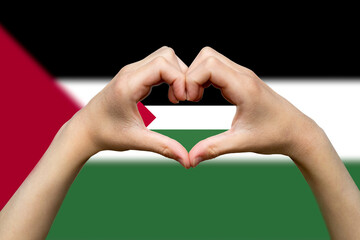 Palestine flag with two hands heart shape, patriotism and nationalism idea, express love or 