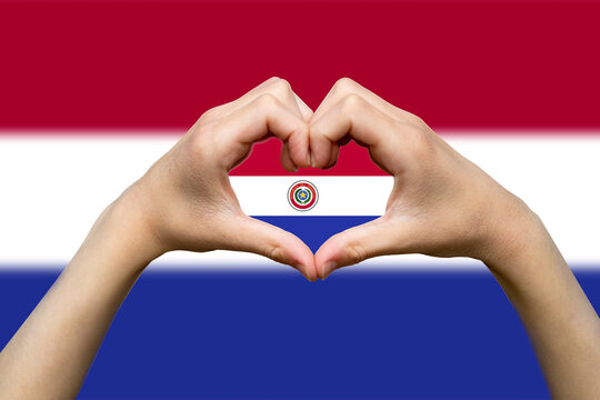 Paraguay flag with two hands heart shape, hand heart love sign, express love or affection concept - Powered by Adobe