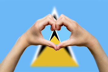 Saint Lucia flag with two hands heart shape, express love or affection concept, support or donate 