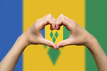 Saint Vincent And G. flag with two hands heart shape, express love or affection concept, patriotism 