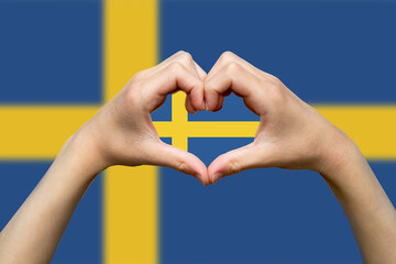 Sweden flag with two hands heart shape, express love or affection concept, vector design, support 