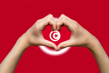 Tunisia flag with two hands heart shape, hand heart love sign, express love or affection concept