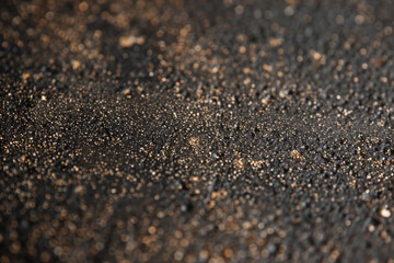 Rough and grainy texture of sandpaper, showcasing its abrasive surface and tactile feel. Sandpaper textures offer a gritty and industrial backdrop