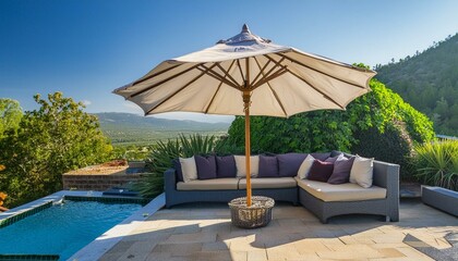 A patio with a large umbrella and a couch