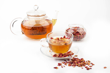 Tea made from tea rose petals in a glass bowl on white background