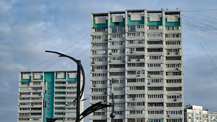 A Soviet multi-storey residential building in a residential area.