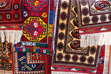 Colorful expensive modern oriental Arabic carpets on oriental bazaar in Uzbekistan