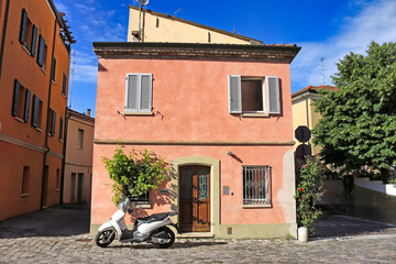 Old colorful houses and scooter in Rimini Italy - 798840063
