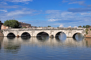 Old stone Tiberius bridge in Rimini Italy summer season - 798840472