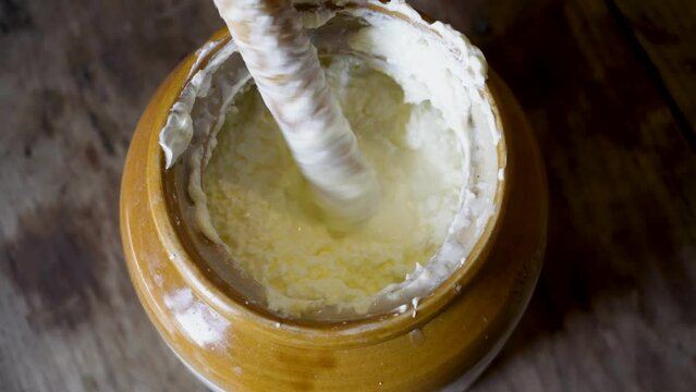 Discover Uttarakhand's Bilona method: curd churned through bilona to extract butter, heated to purify into ghee. Authentic Indian tradition