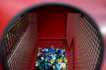 Warsaw, Poland - April 25th 2024: Place for collecting colorful plastic bottle caps for recycling...