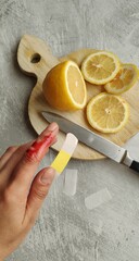 Closeup of bloody woman's hands with band-aid. Bandage on an injured finger. 