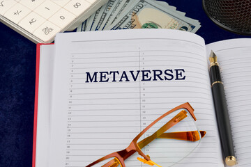 Business, universe or metaverse concept. Metaverse symbol written in the businessman's notebook