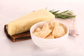 Chopped Italian hard parmesan cheese