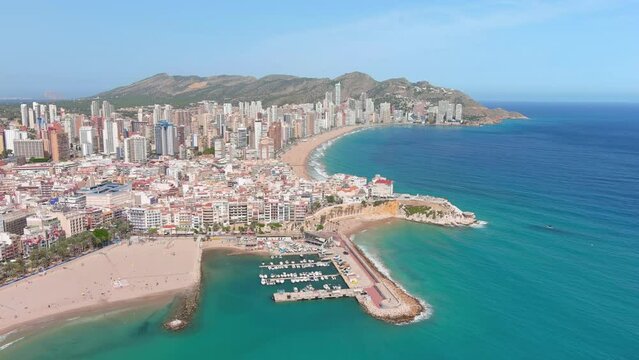 Benidorm, Spain: Aerial view of beach Playa de Levante (Platja de Llevant) in famous summer tourist resort by Mediterranean Sea, summer day with blue sky - landscape panorama of Europe from above
