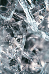 Shattered glass shards, featuring jagged edges and transparent fragments. Glass shard textures offer a dramatic and dynamic backdrop