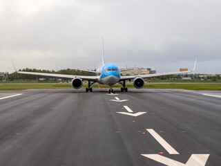 Fototapeta na wymiar airplaine on take off runway airstrip in Schipol Airport