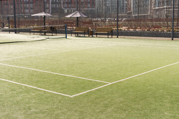 Tennis net on a green field