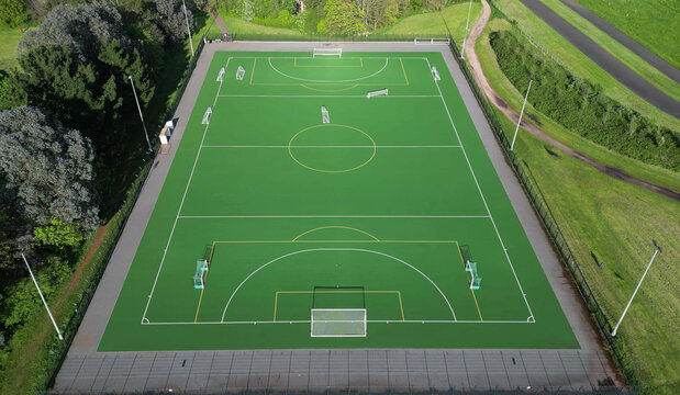 Paignton, Torbay, South Devon, England: DRONE VIEW: Overhead view of an all-weather sports pitch used for football, five-a-side soccer and field hockey. It is part of Clennon Valley playing fields.