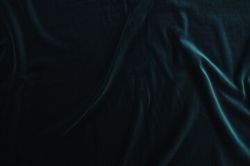 Texture of dark blue velour fabric, top view. A noble marine shade with rich drape and a smooth...