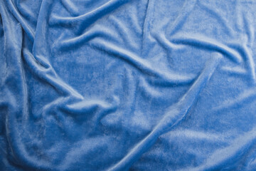 Texture of light blue velour fabric, top view. A noble sky shade with rich drape and a smooth...