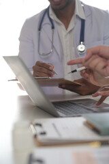 Fototapeta premium Medical Team Meeting Around Table In Modern Hospital