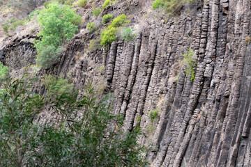 Hexagonal basalt rock columns formation. In Organ Pipes national park, Victorai Australia