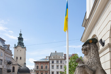 Lion monument in Ukrainian military beret near Lviv city hall