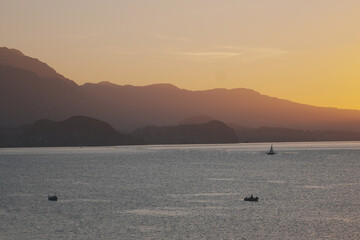 sunset on the lake with boat