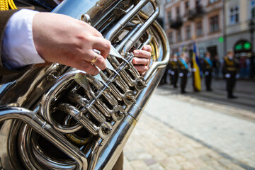 Closeup of hands playing tuba