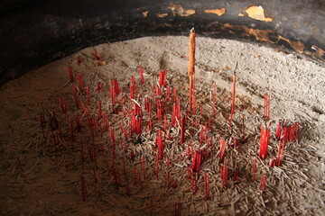 photo of old incense sticks in the burner