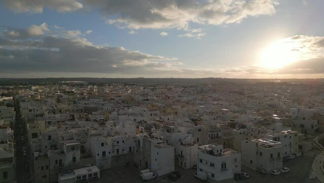 Sunset in the city at Polignano a Mare, Italia, Puglia, seaside drone video
