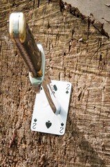 Throwing knife in playing card