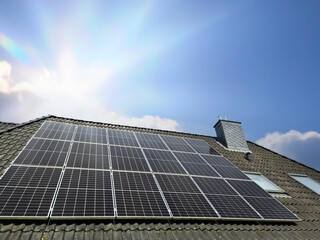 Solar panels producing clean energy on a roof of a residential house