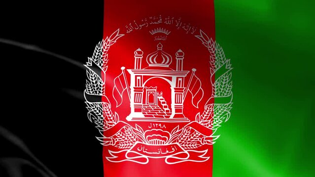 The flag of Afghanistan flying in the wind. The concept of patriotism and love of country.