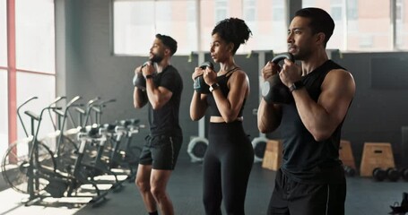 Squats, kettlebell and coach in gym for fitness, exercise or workout with cycle for sport. Weights, personal trainer or people in gymnasium for wellness, training or health with focus together