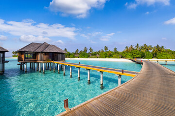 Paradise seaside wooden pier in Maldives. Idyllic tropical beach landscape for background wallpaper. Design of tourism summer vacation, destination. Exotic island scene, relaxing view palm trees sea