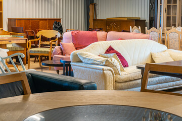 A big furniture store, second-hand. A lot of different furniture in the warehouse.