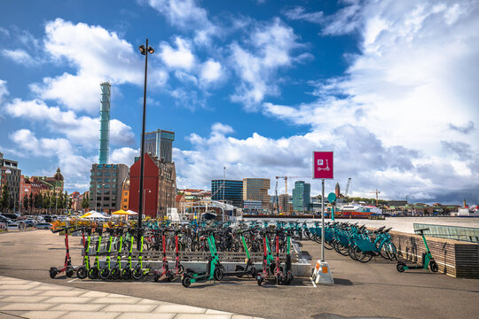 Electric scooter and bicycle hub in Gothenburg harbor view