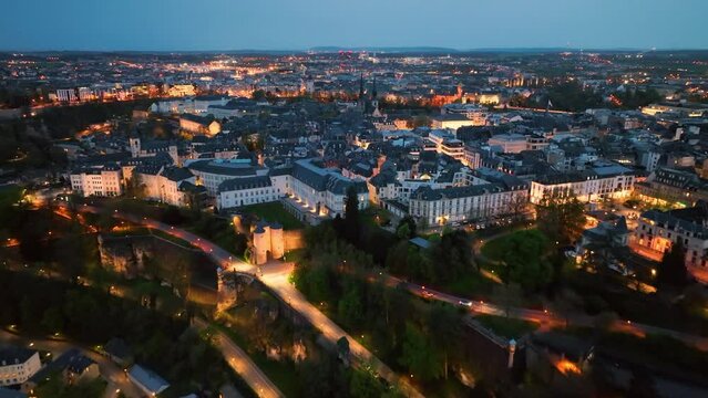 4K Aerial view of a Grand Duchy of Luxembourg , city skyline to night at Grund along Alzette river in the historical old town of Luxembourg