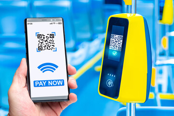Paying for bus fare. Wireless payment terminal in public transport. Phone with application for QR...